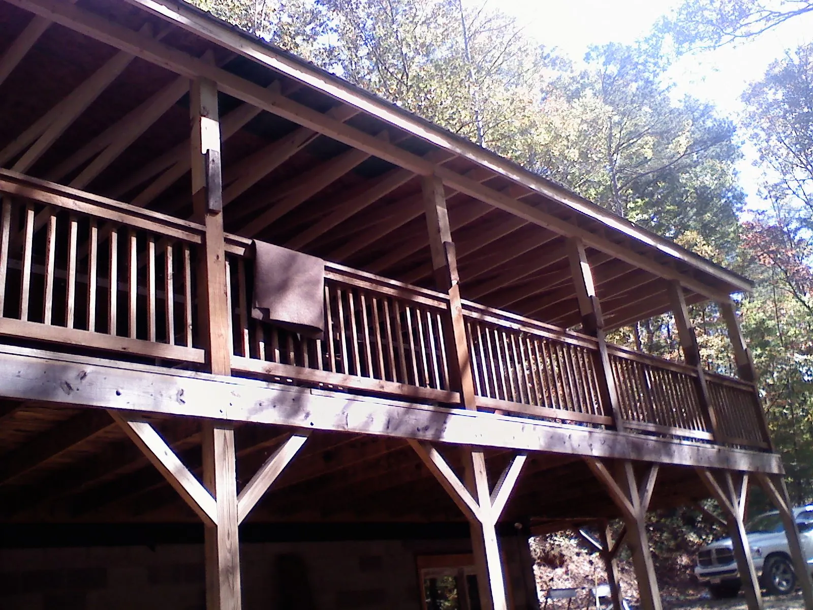 Timber framing under a new elevated porch and deck — Roof Leak Repair in Jerusalem by Roofing Brothers
